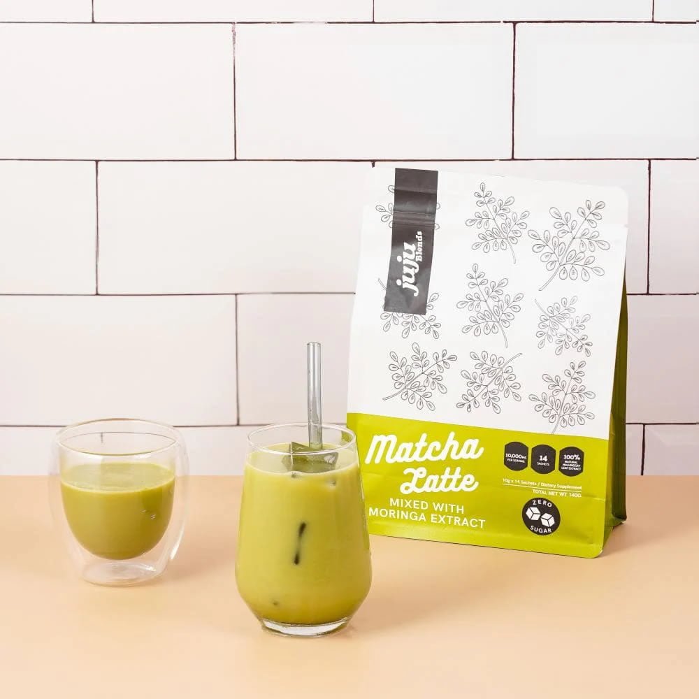 A glass of matcha and another glass of iced matcha latte