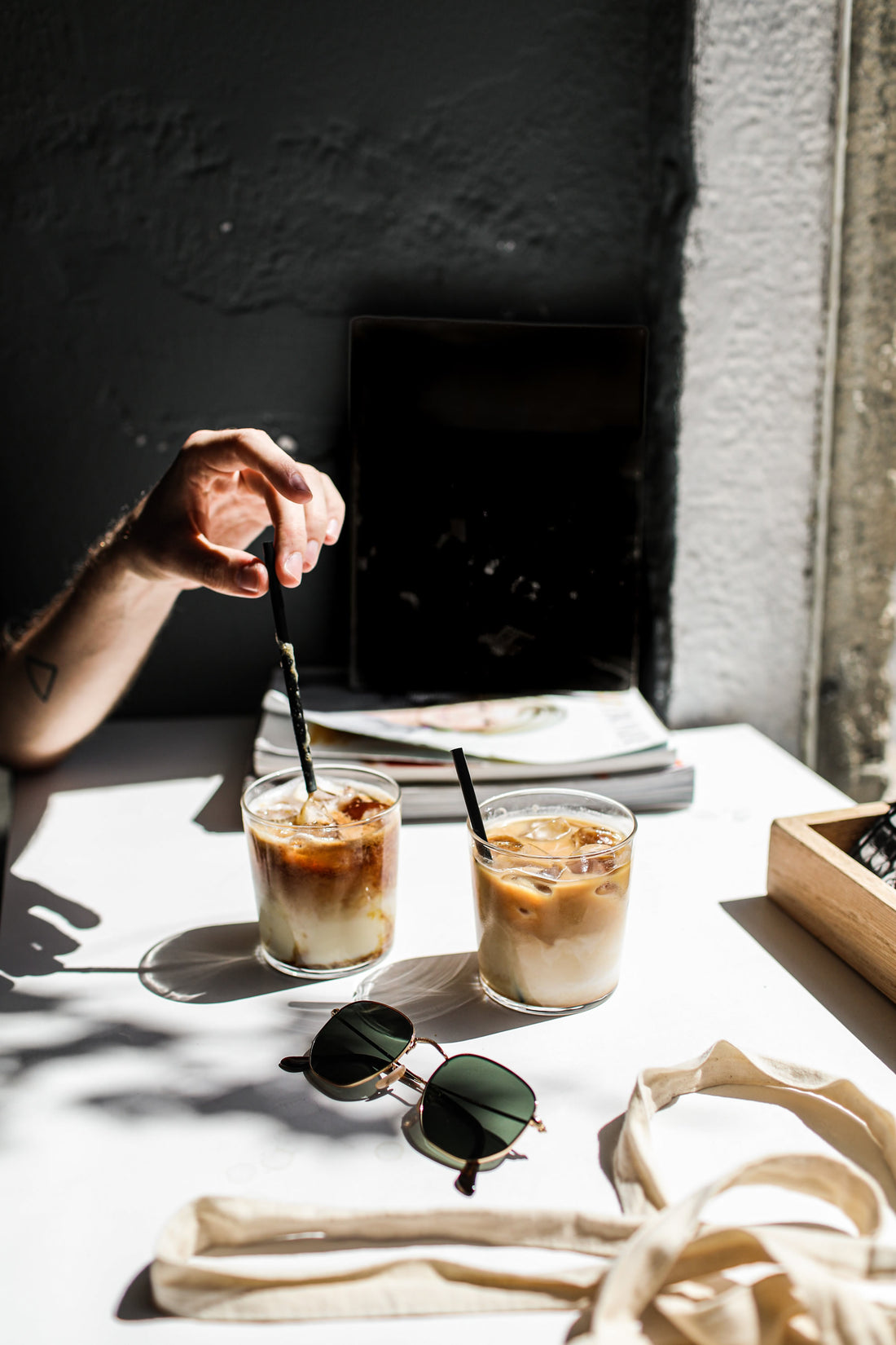 One cup of ice latte and another cup of iced coffee