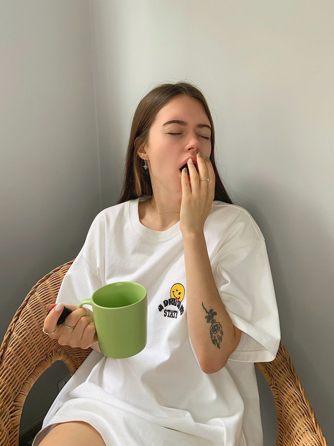 woman drinking coffee and feeling sleepy